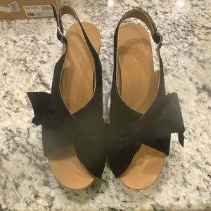 Ladies sx 11/12 UGG black wedge shoes. Barely worn/excellent condition/like new.